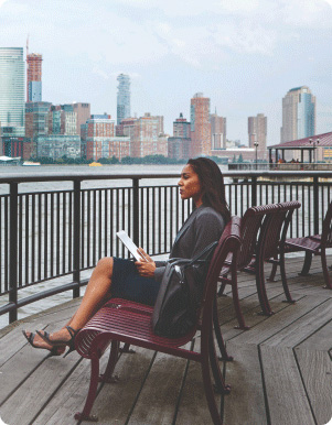 A lady sitting on a bench