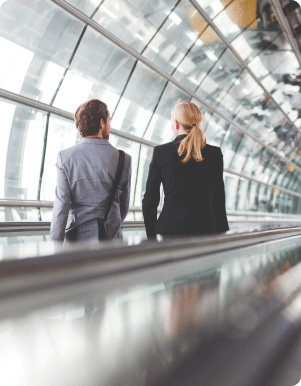 Two persons going down the elevator